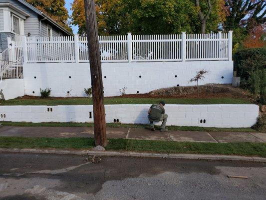 Completed - fence, sod and plants installed.