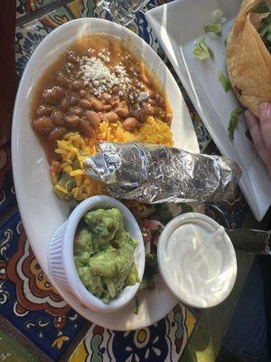 Beans, rice, guac, and sour cream with the fajitas