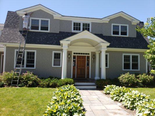 Painting a home exterior in Addison, VT