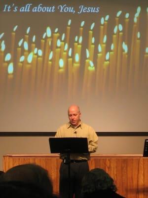 Our preacher, Dave Altizer, during the annual candle-light Christmas Eve Service.