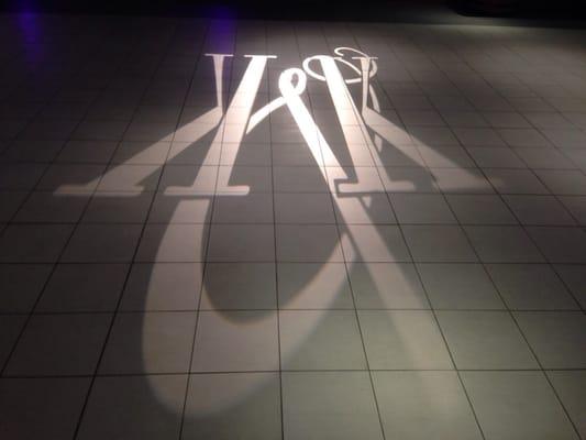 Gobo projection of Kaitlyn & Ken's monogram on the dance floor