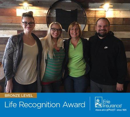 Dolbow Insurance Agency located in Westerville, Ohio, accepts the Bronze Life Recognition Award from Erie Insurance. (614) 899-1611.