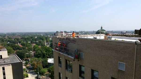 High rise in st.l ouis  laying brick and tuckpointing