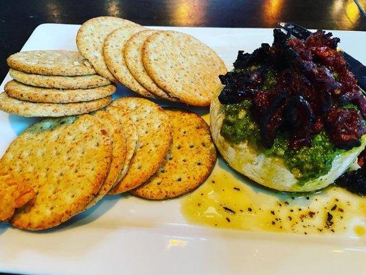 Brie with Pesto and crackers.