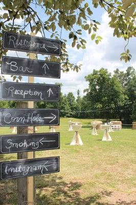 Chalkboard sign, bistro tables, linens & sashes provided.