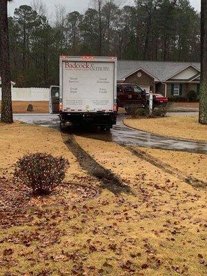 Badcock delivery truck messing up the lawn after getting stuck delivering furniture.