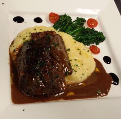 Beef short rib with Asiago polenta broccolini tomatoes with red wine beurre blanc sauce