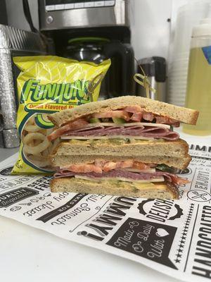 THE RUBIO cold sandwich with firecracker sauce, tomatoes , provolone cheese , hard salami & Fresh Jalapeños