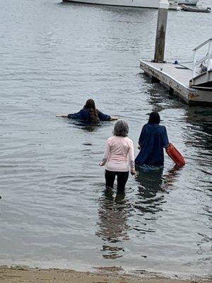 Immersion of a candidate in Newport Bay.