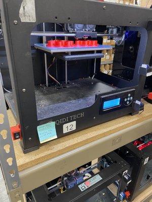 3-D printer in action creating a cookie cutter