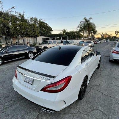 CLS63s AMG Roof, roof rails, and window trims done in Avery Gloss Black