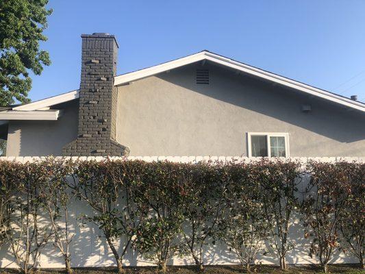 After. Neutral Wave for the stucco, Iron-IC for the brick (front of house and chimney), and Sugar Swizzle for the fascia, fence, and gate!