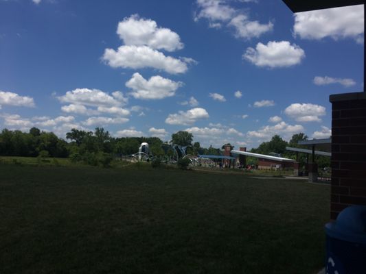 Splash pad children's play area across the open field