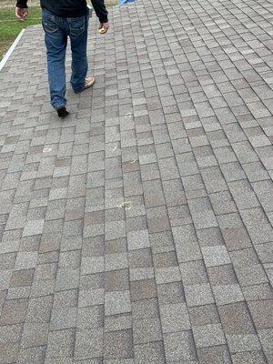 Inspecting roof, marking hail hit locations