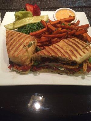 Panini with mushroom, and peppers accompanied by sweet potatoes fries