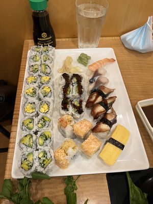 Our first plate of maki (california, mango and cucumber, veggie, eel and avocado, snow mountain), and nigiri (ebi, saba, eel, tamago)