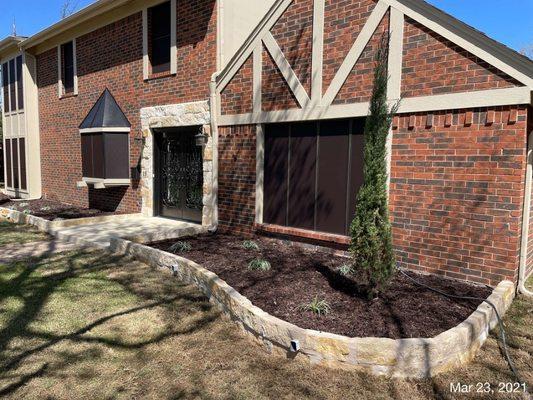 Landscaping 
Stone flower bed included