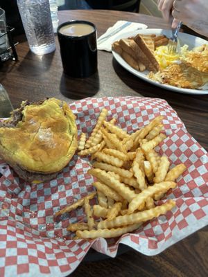 Mine: Cheeseburger with American cheese, French fries.   His plate: Hash browns, toast, sausage, eggs