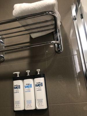 Full size shampoo, conditioner, body wash in bathroom