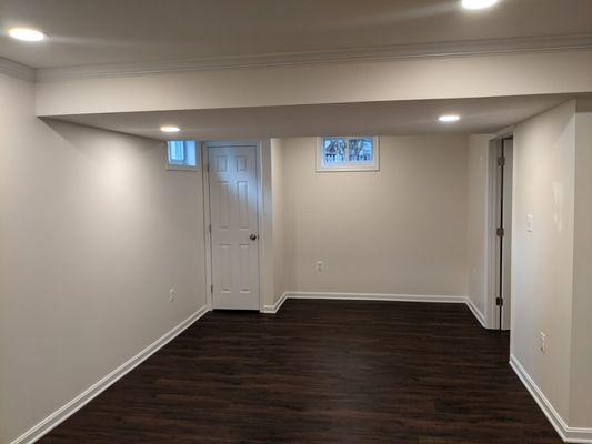 Closed off utility room with updated lighting.