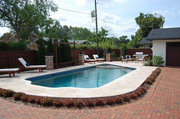 Pool, deck, drive and landscape renovation by Shane Rathel, Inc.