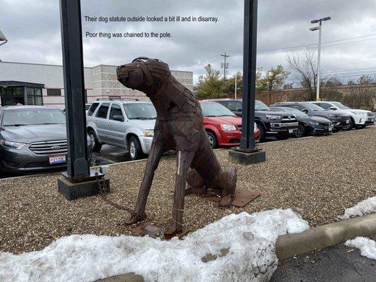 Even their dog statute chained outside looks ill and in disarray.