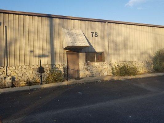 The front of the building. The office is inside that door.