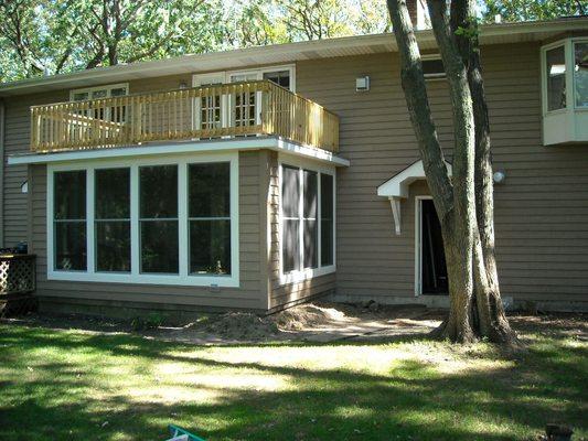 Sun room with Marvin windows and door and second floor deck off of the master suite.