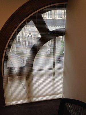 Custom made blinds for an arched window