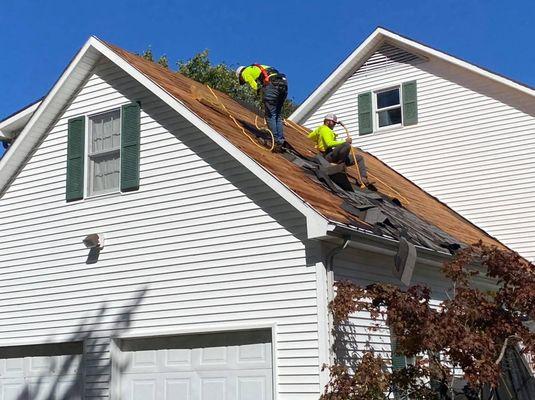 Working hard on removing and installing a new roof for a family in Union City Tennessee