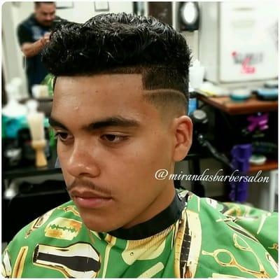 Mid Bald fade with a side part.