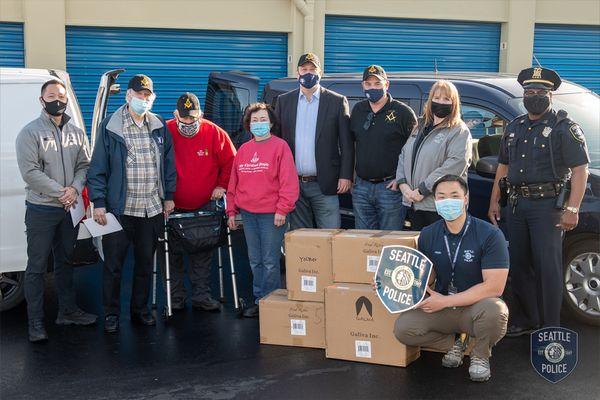 Christmas People and St. Johns Lodge #9 supplies Seattle SPO with socks for homeless