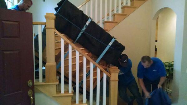 Back to upright position, going down the of the stairs.