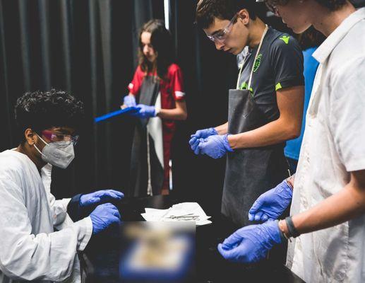 High School students work diligently in a science lab on our River Campus.