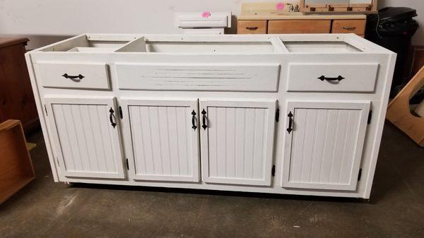 Antique sink base custom island with bead board doors.