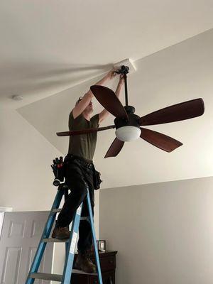 Installing a new ceiling fan.