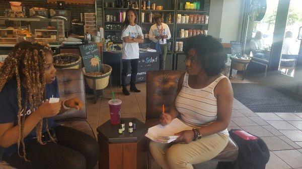 NUBODI Holistic Health Practitioner and Clinical Aromatherapist doing an aromatherapy consultation with a client.