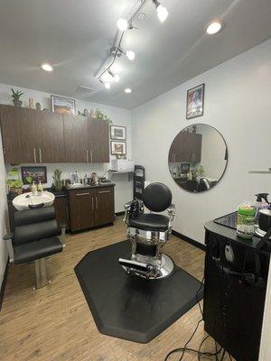 Barber chair with shampoo bowl and cabinets