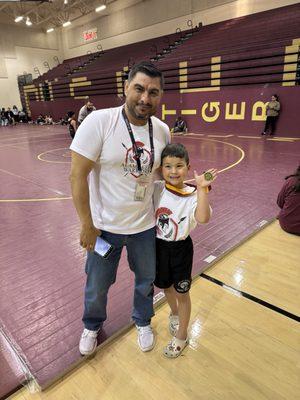 With Coach after first wrestling tournament. Pulled out the Gold.