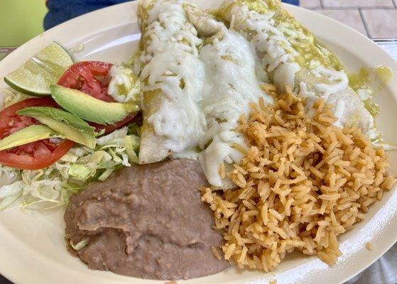 Green chicken enchiladas with rice and beans