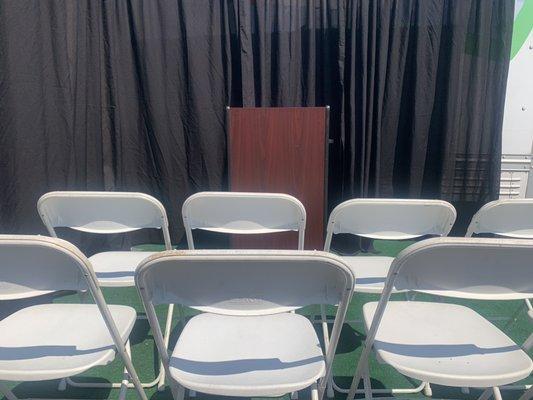 Podium backdrop and audience chairs