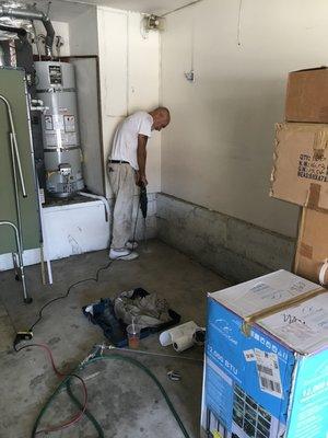 Drilling holes in concrete flooring for subterranean termite treatment