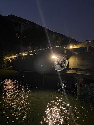 Bridge lit up over lake