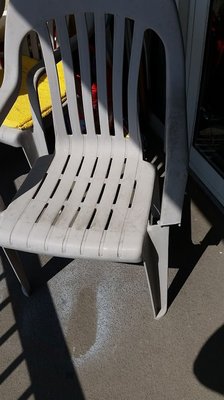 Broken chair on balcony