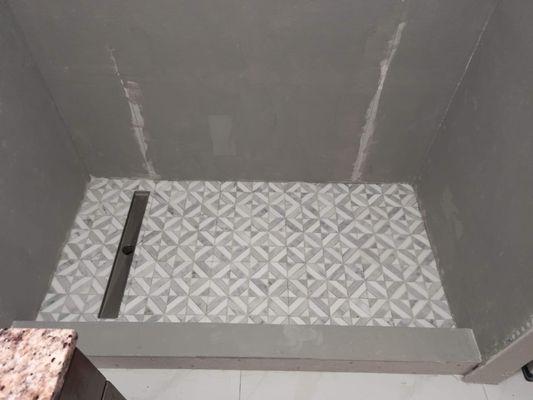 Completed bathroom with drain