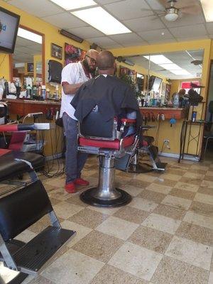 Nate at work perfecting this fade and beard job!