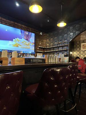 A view of the right side of the bar, with the large flat screen.