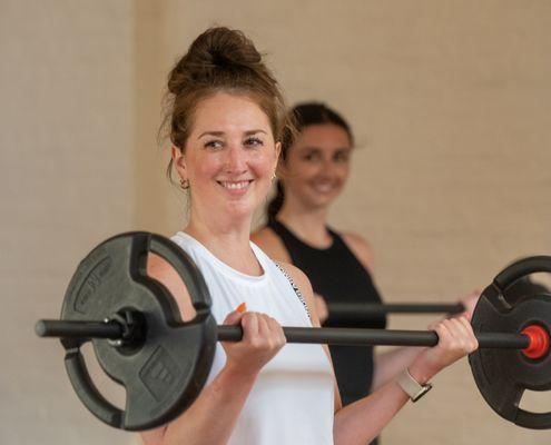 We use barbells, weight plates, and body weight in Group Power. And we LOVE those bicep curls!