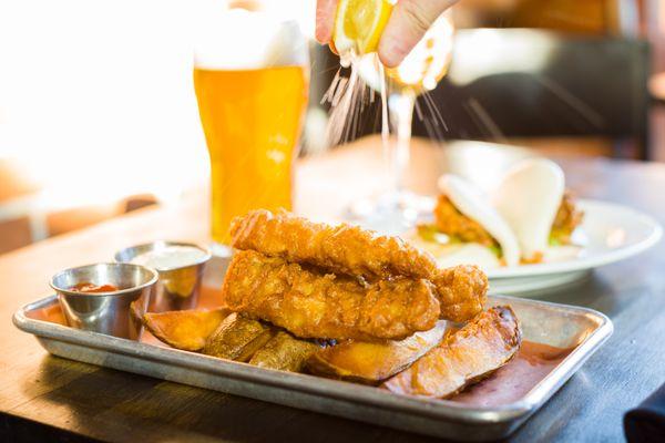 Fish and Chips- Beer-battered cod, potato wedges, tartar sauce.