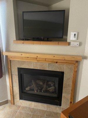 Fireplace and tv in room